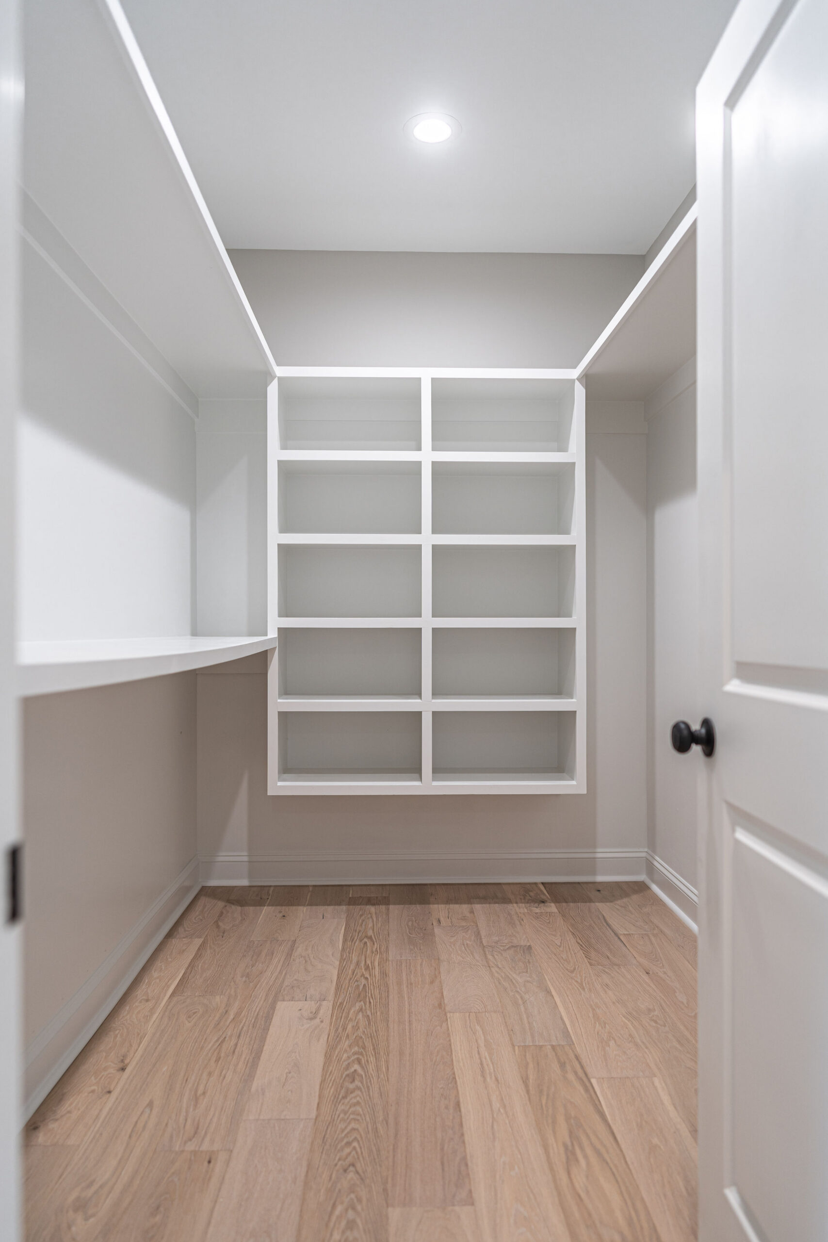 31. custom wooden shelving in master closet